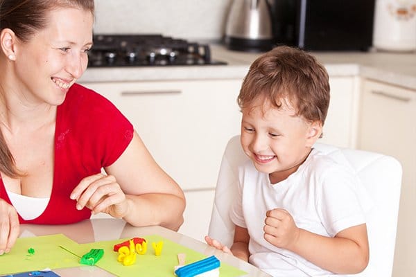 child and mum playing playdoh