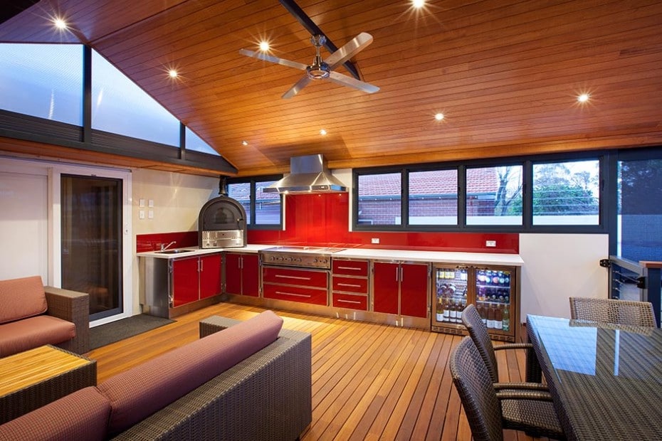 outdoor kitchen with red cabinets