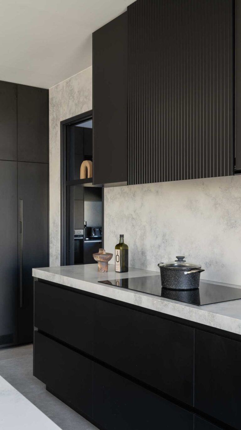 Grey Marble kitchen with black cabinetry