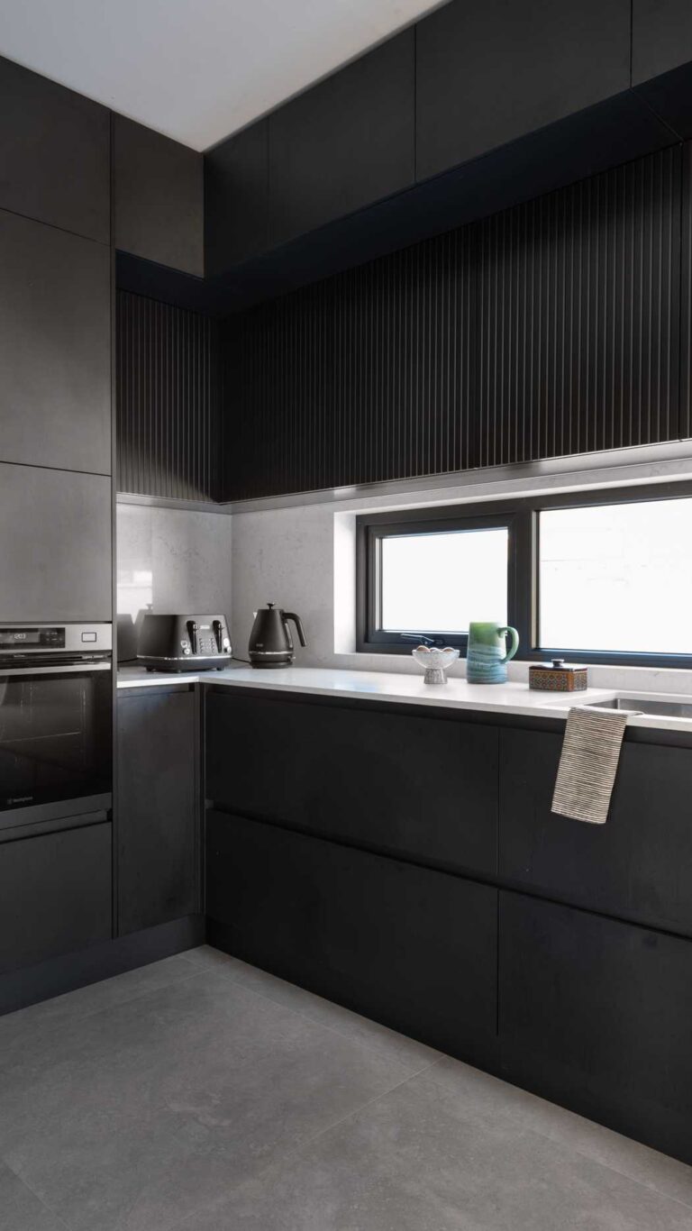 Black scullery with black cabinetry