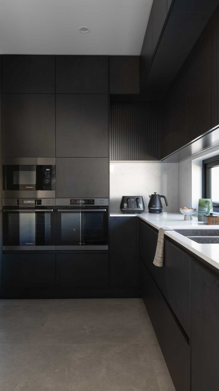 Black scullery with black cabinetry