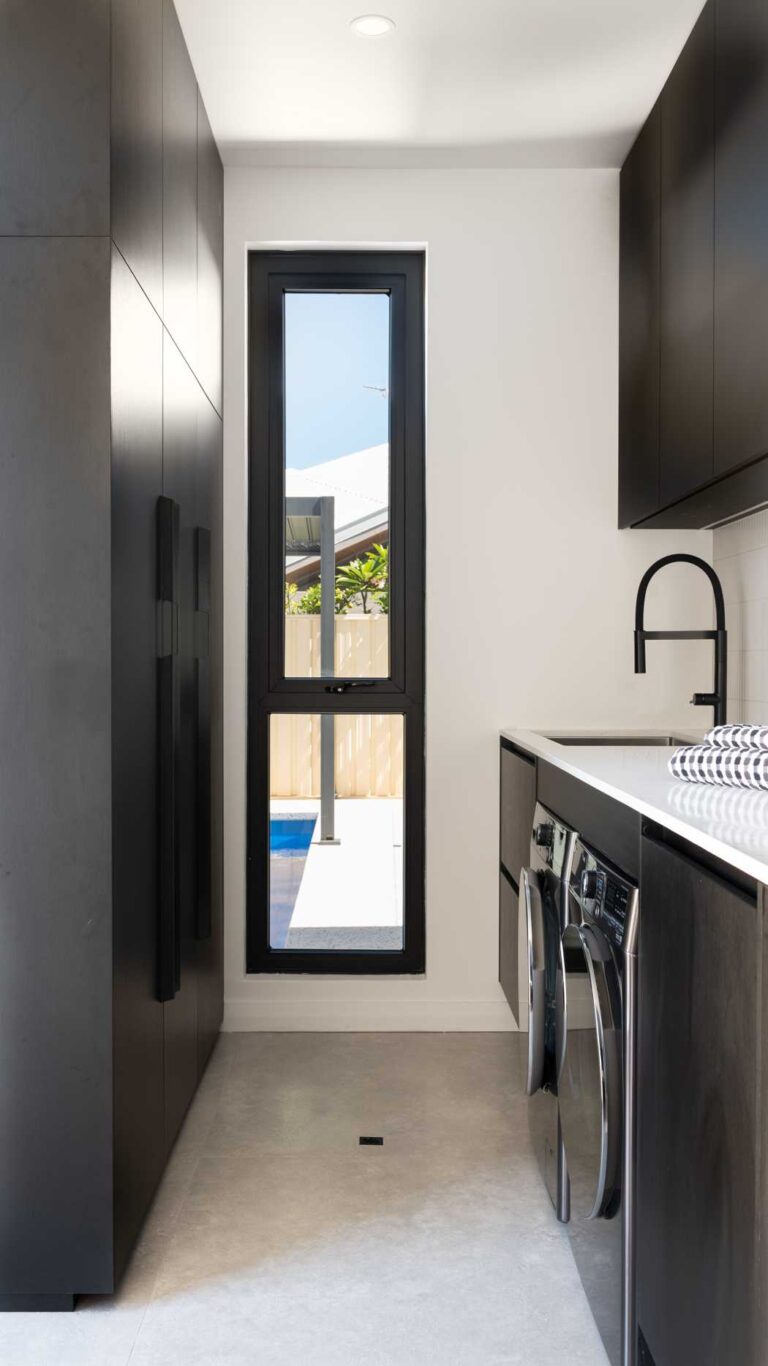 Black laundry with black cabinetry
