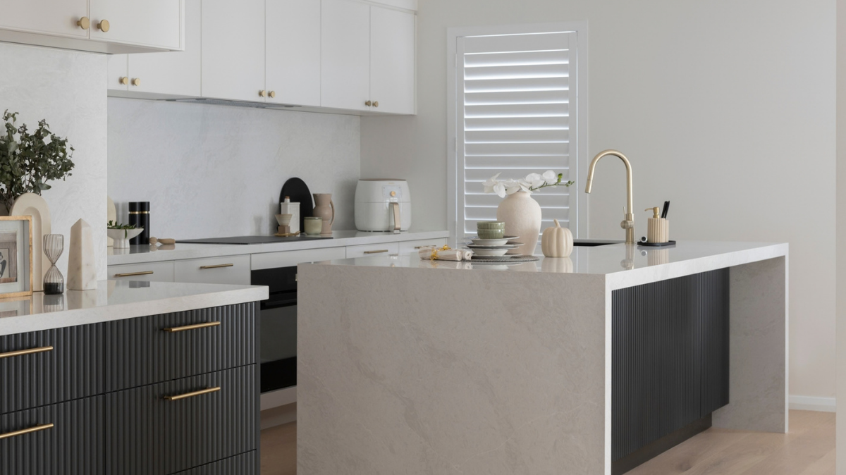 Caesarstone Benchtops 5 Fluted black kitchen island with Caesarstone Glacier Flow waterfall benchtop and splashback in a Scarborough renovation by Kitchen Craftsmen